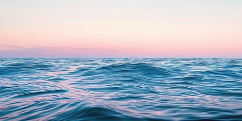 Obraz premium Beautiful ocean with a pink and blue sky background