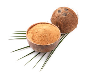 Coconut sugar in bowl, fruit and palm leaf isolated on white