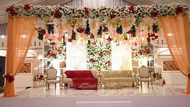 Aesthetic wedding stage decoration with beautiful flowers and. Marriage Decoration. Decorative Floral Interior in Wedding Ceremony Background.