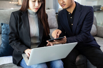 Asian man and woman with financial planner from home, Business financial planning concept. 