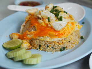 Crab meat fried rice topped with Scrambled egg, style Thai food