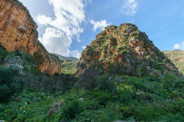Obraz premium Mountain landscape with rock formations at the Zingaro Nature Reserve at the mediterranean sea, San Vito Lo Capo, Sicily, Italy