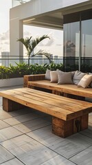 Modern garden terrace with wooden outdoor furniture, sofa and coffee table in the center of an urban courtyard surrounded by green plants