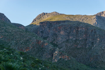 Mountain landscape with rock formations at the Zingaro Nature Reserve at the mediterranean sea, San Vito Lo Capo, Sicily, Italy