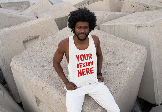 Mockup of man wearing customizable vest on concrete blocks