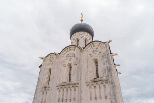 View of Church of the Intercession on the Nerl, temple in the Vladimir region of Russia, built in the 12th century. Relief with David the psalmist, lions and griffins on the facade of Church.