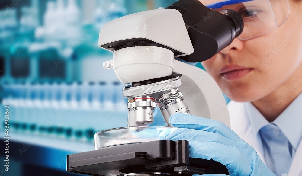 Poster scientist work using microscope in modern laboratory