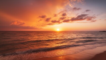 A fiery sunset paints the sky in vibrant hues of orange and purple as waves crash gently on the shore. 