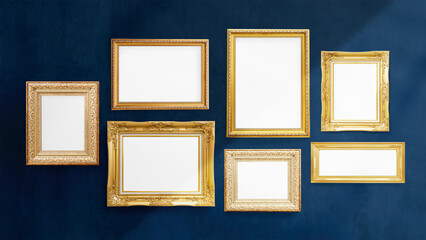 Luxurious baroque frame mockups hanging on a dark blue wall