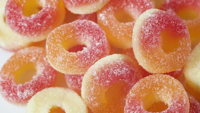 sweets peach ring gummy candies on the white background. - Powered by Adobe