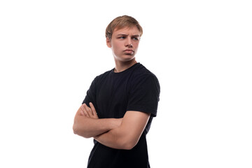 Obraz premium Portrait of a European handsome blond teenager guy with a confident look