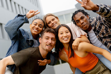 Portrait of a multiracial and diverse group of friends and classmates in a positive attitude of...