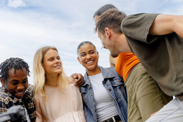 multiracial group of united friends celebrating friendship and having a good time together.