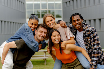 Portrait of a multiracial group of friends and classmates in a joyful attitude of unity and...