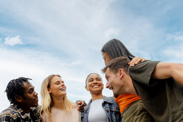 portrait of Group of young boys and girls together celebrating friendship and unity. Multiracial...