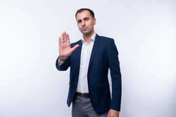 Smart handsome caucasian man in a white shirt on a white background
