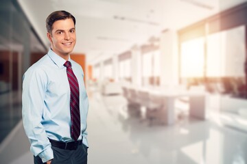 Happy young business man  in office.