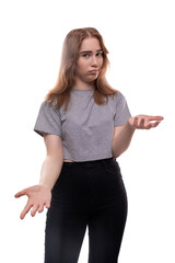 European doubting teenager girl in a gray T-shirt with blond hair on a white studio background