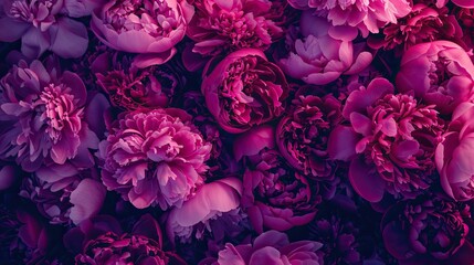 A bouquet of pink peonies in full bloom, set against an outdoor garden background with copy space for text or design elements.