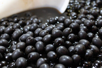 Black olives background. Spanish appetizer