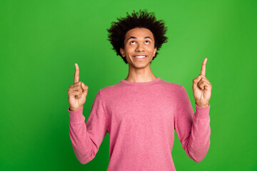 Photo of funky cool guy dressed pink pullover showing two fingers up emtpy space isolated green...