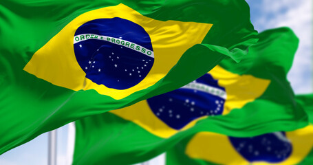 Close-up of three Brazil national flags waving in the wind