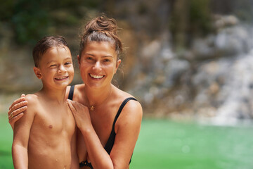 Fototapeta premium Photo of mother with son in Gozalandia Waterfalls