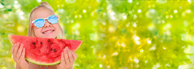 close-up happy cool trendy funky hipster blonde girl in sunglasses eating ripe red watermelon,...