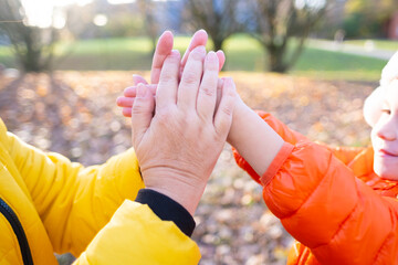 child's hands frozen, mother warms, rub cold palms girl on walk, overall family health strategies,...