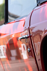Antique Elegance: Classic Red Sports Car with Leather Interior and Distinctive Headlamps