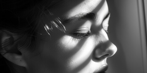 Fototapeta premium A woman with dark hair and a black and white photo of her face