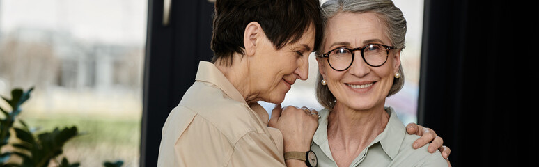 Two women standing side by side.