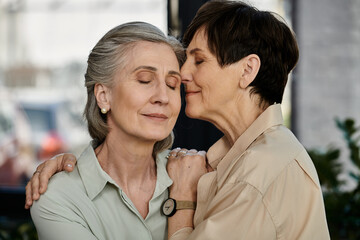 Two women posing in a heartwarming moment.