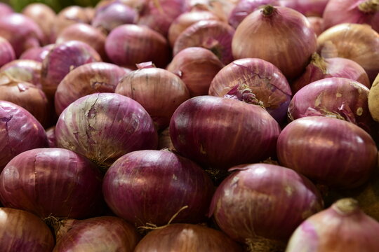 Onions at a vegetable stall at a market