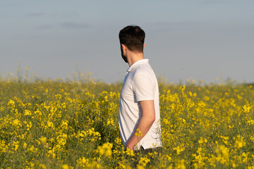 Fototapeta premium Joyful Summer: A Happy Child with Chaplet in a Blooming Meadow