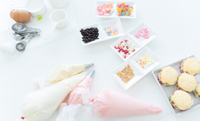 Selective focus on icing candy, chocolate flakes or coated sugar and jelly in tray for decorating....