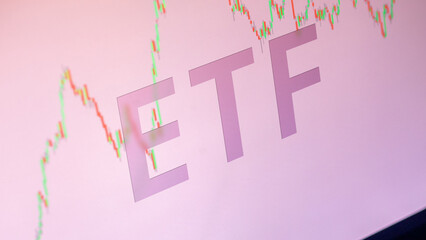 ETF on a stock exchange, exchange traded fund letters on a stock charts.