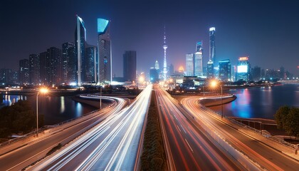 Fototapeta premium A captivating view of a modern cityscape at night, with illuminated skyscrapers towering over a bustling highway interchange. 