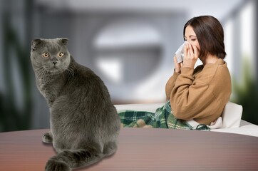 young person sneezing from cat allergy at home.