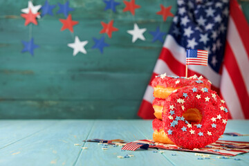 Patriotic sweet donuts 4th july with american flag. Delicious american donuts with red icing and...
