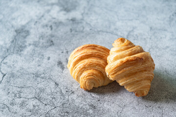 Homemade fresh croissants on male background, famous bakery menu in cafe