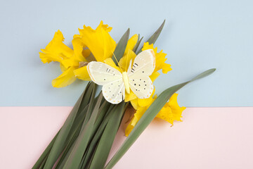 a bouquet of daffodils with a butterfly on it