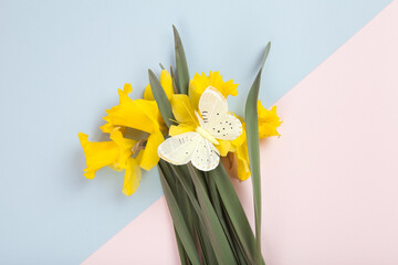 a bouquet of daffodils with a butterfly on it