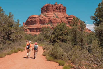 Sedona, Arizona, USA - May 13, 2024: Couple walks hand in hand toward Bell Rock in Sedona, Arizona