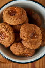 A bowl with pepas cookies on a table