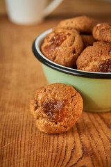 A bowl with pepas cookies on a table