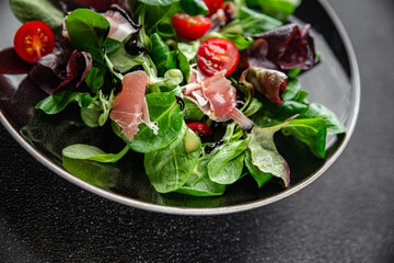 jamon salad green leaf lettuce, tomato, salad dressing appetizer meal food snack on the table copy...