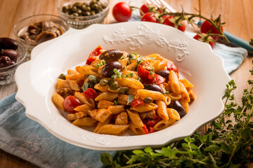 pasta with sword fish tomato black olives and capers