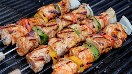 Barbecue skewers, cooking chicken breast, on the grill. Chicken Shish Kebab