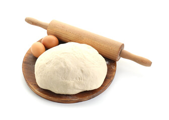 Raw dough, eggs and rolling pin isolated on white